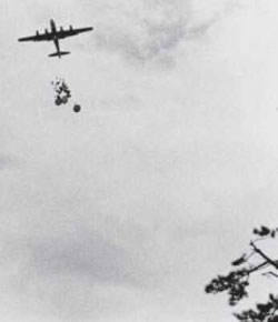 B-29 dropping food and supplies by parachute over POW camp Fukuoka #3, Tobata, Kyushu, Japan, September 13, 1945